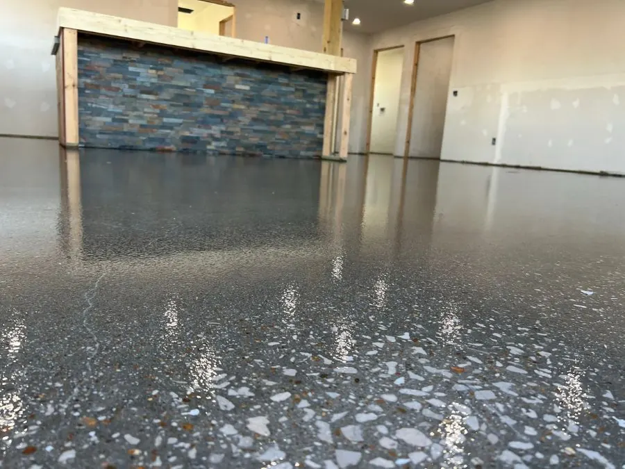 Polished quartz commercial floor coating with stone bar feature in Springfield, MO
