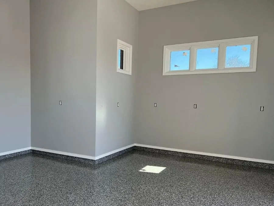 Grey flake epoxy floor coating in a new construction Springfield, MO bonus room