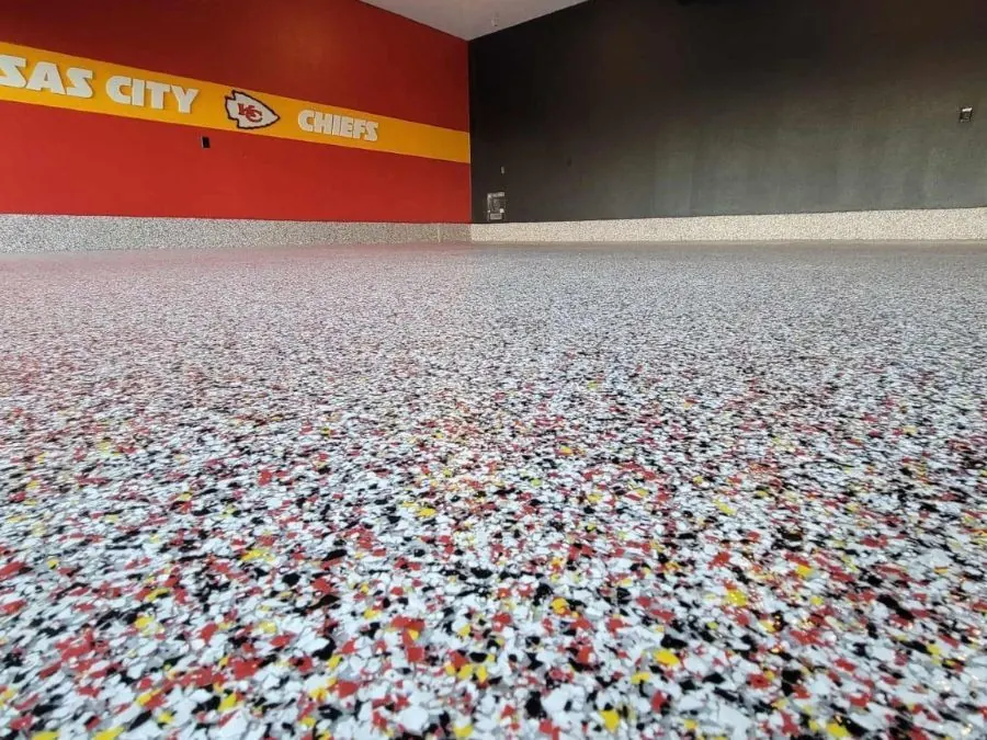 Kansas City Chiefs themed man cave with red and gold flake epoxy floor coating in Springfield, MO